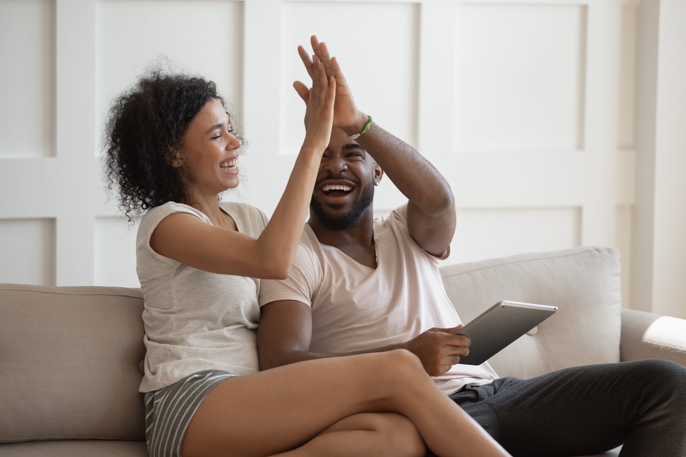page_53_stock-photo-excited-african-wife-gives-high-five-husband-holding-tablet-computer-young-couple-celebrating-1517175491.jpg